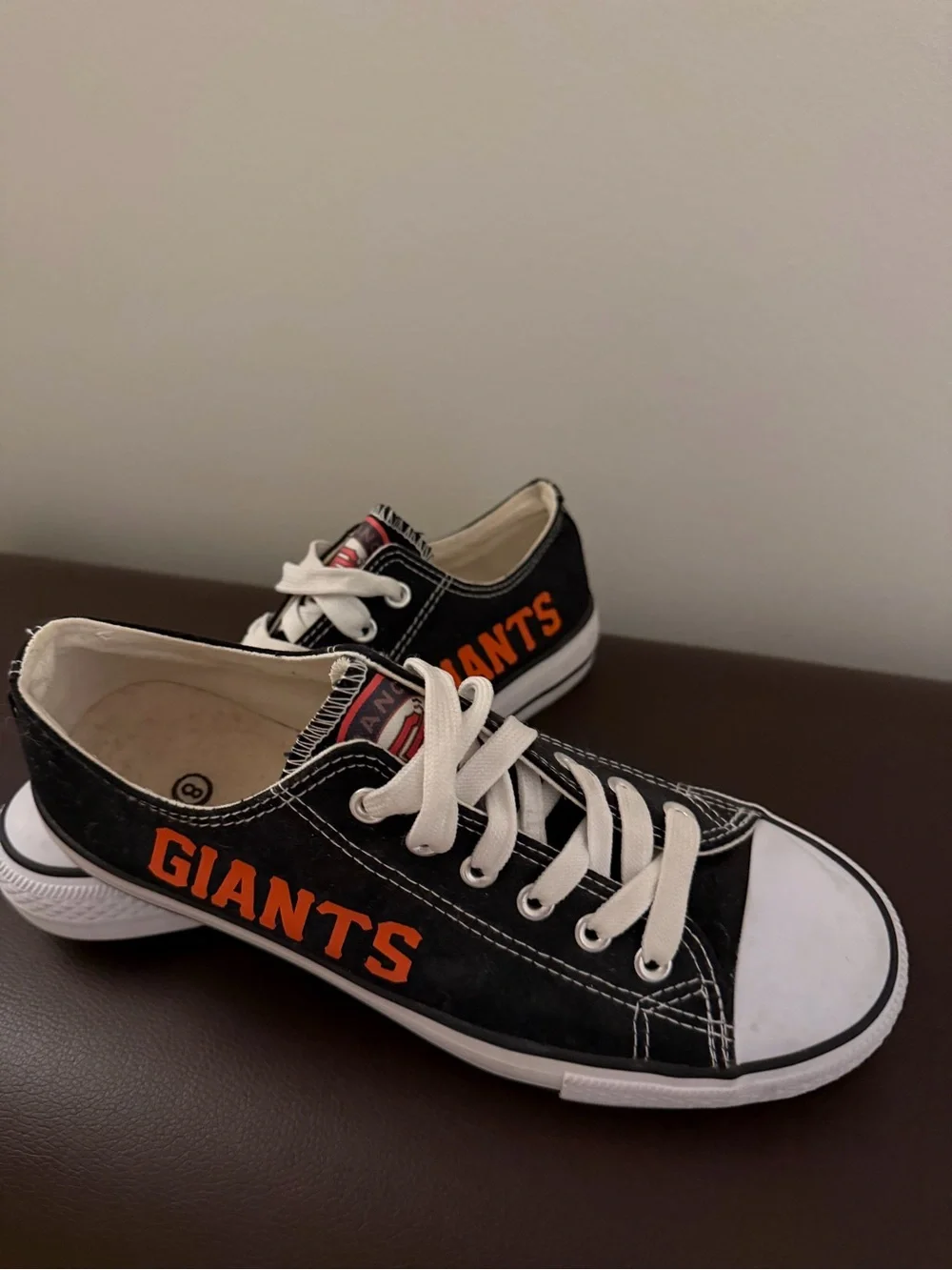 Black Low-Top Athletic Sneakers with Orange 'GIANTS' Accent